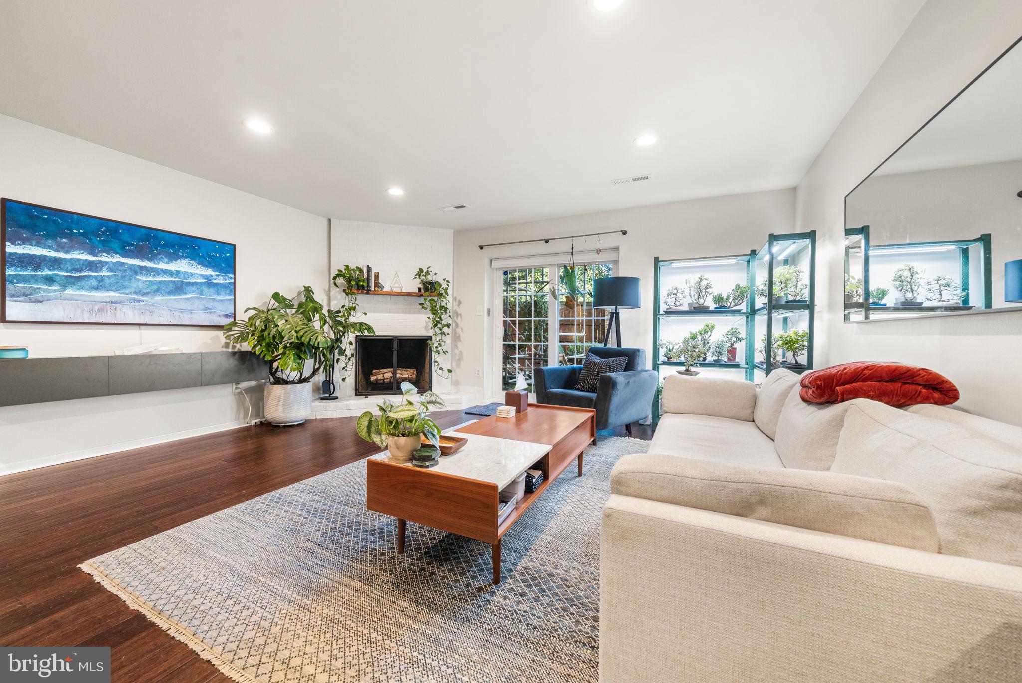 907 South Rolfe Street, Unit 1A Arlington, VA 22204 - Photo 12 of 36 a living room with furniture and a wooden floor