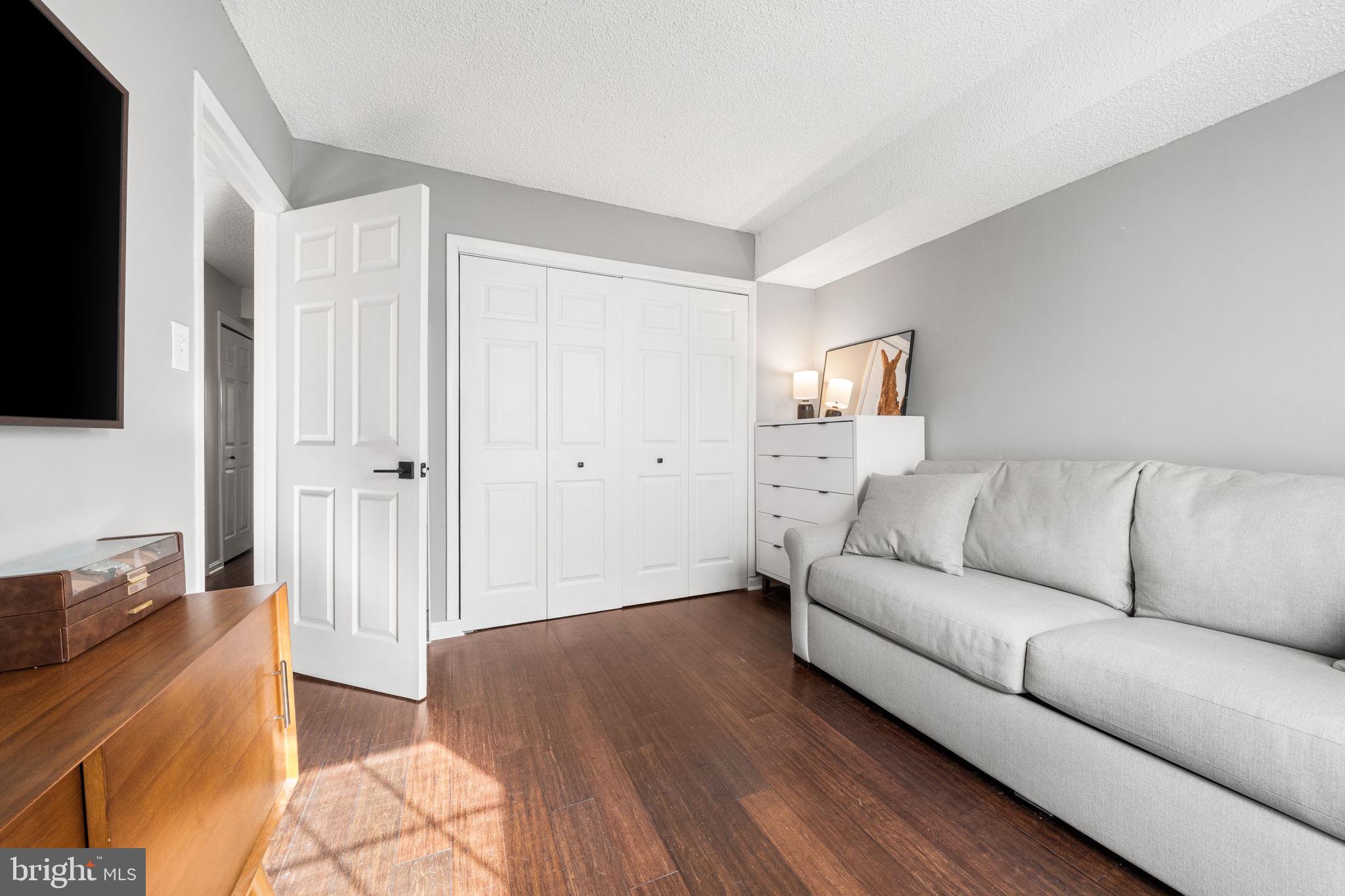 907 South Rolfe Street, Unit 1A Arlington, VA 22204 - Photo 22 of 36 a living room with furniture and a flat screen tv