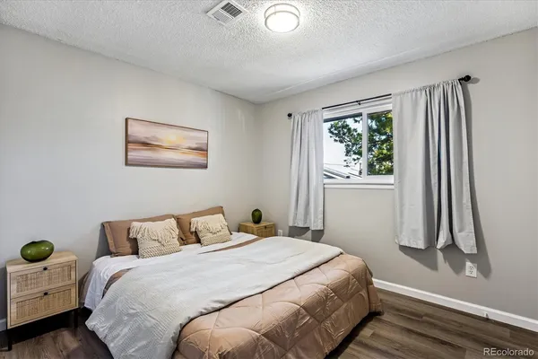 a bedroom with bed and a window