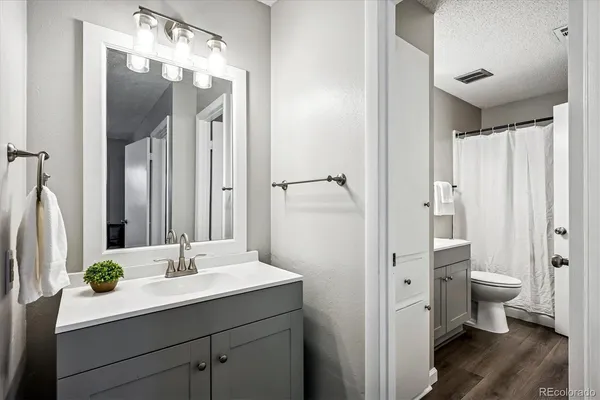 a bathroom with a double vanity sink and mirror