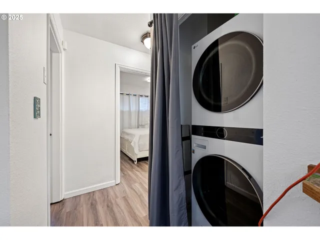a view of a hallway with washer and dryer