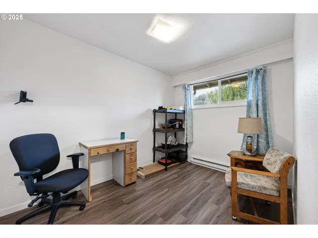 a room with furniture and a workspace