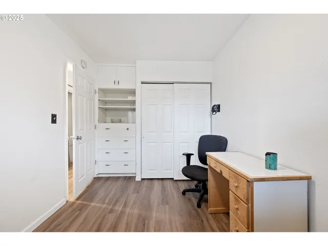 a room with furniture and wooden floor
