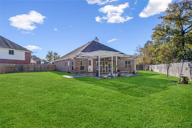 a house view with a sitting space and garden