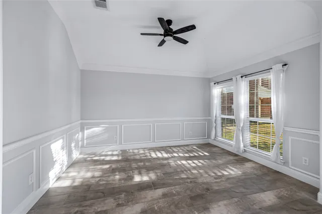 a view of an livingroom with furniture fireplace and wooden floor