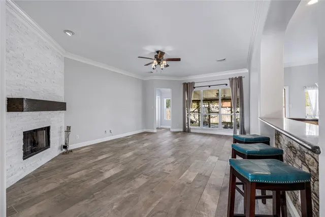 a view of a livingroom with a fireplace and cabinet