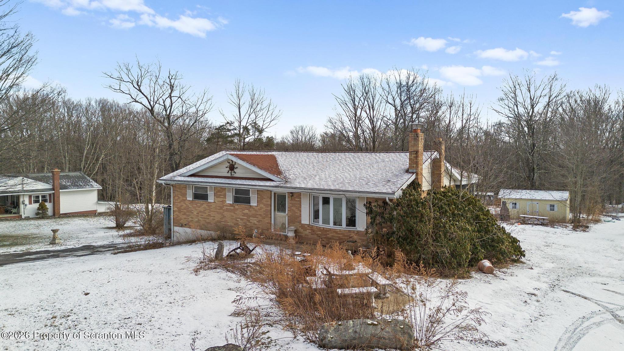 82 Jubilee Road Gouldsboro, PA 18424 - Photo 39 of 39 a view of a house with a yard covered in snow