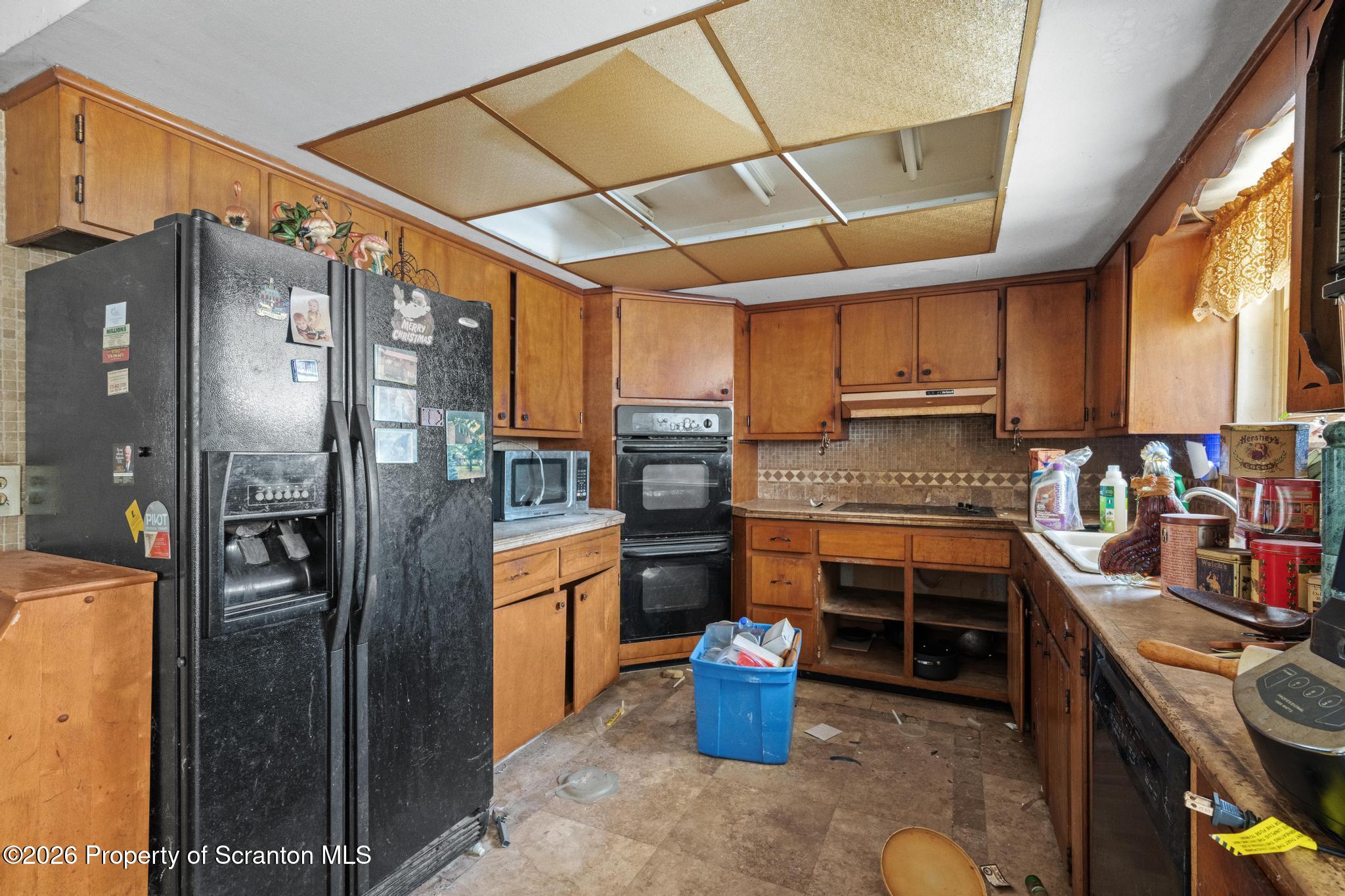 82 Jubilee Road Gouldsboro, PA 18424 - Photo 5 of 39 a kitchen with stainless steel appliances granite countertop a refrigerator a stove and a sink