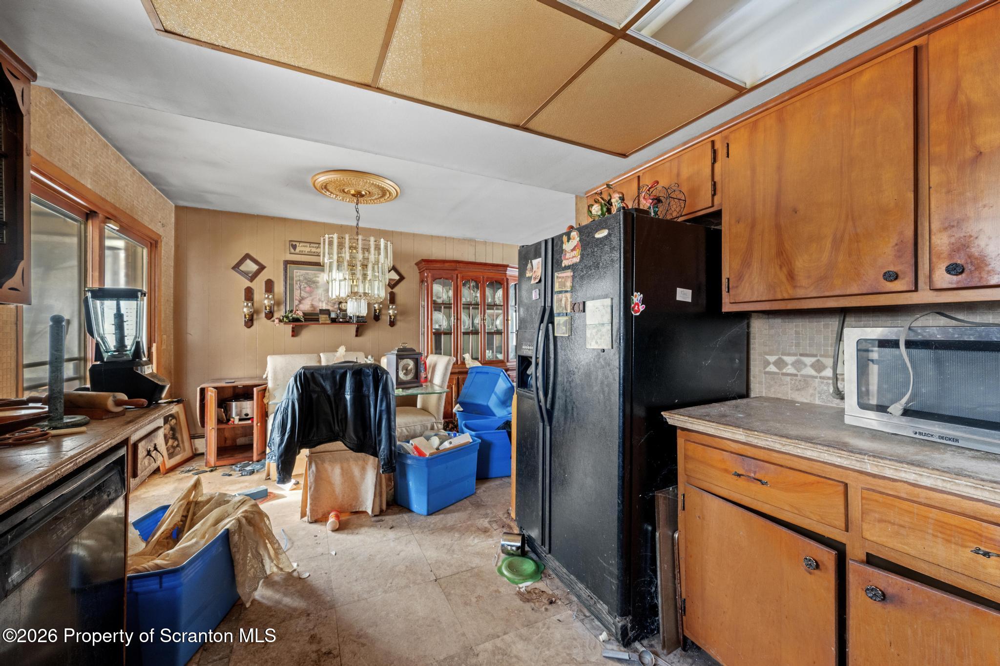 82 Jubilee Road Gouldsboro, PA 18424 - Photo 6 of 39 a kitchen with stainless steel appliances granite countertop a refrigerator and a stove top oven