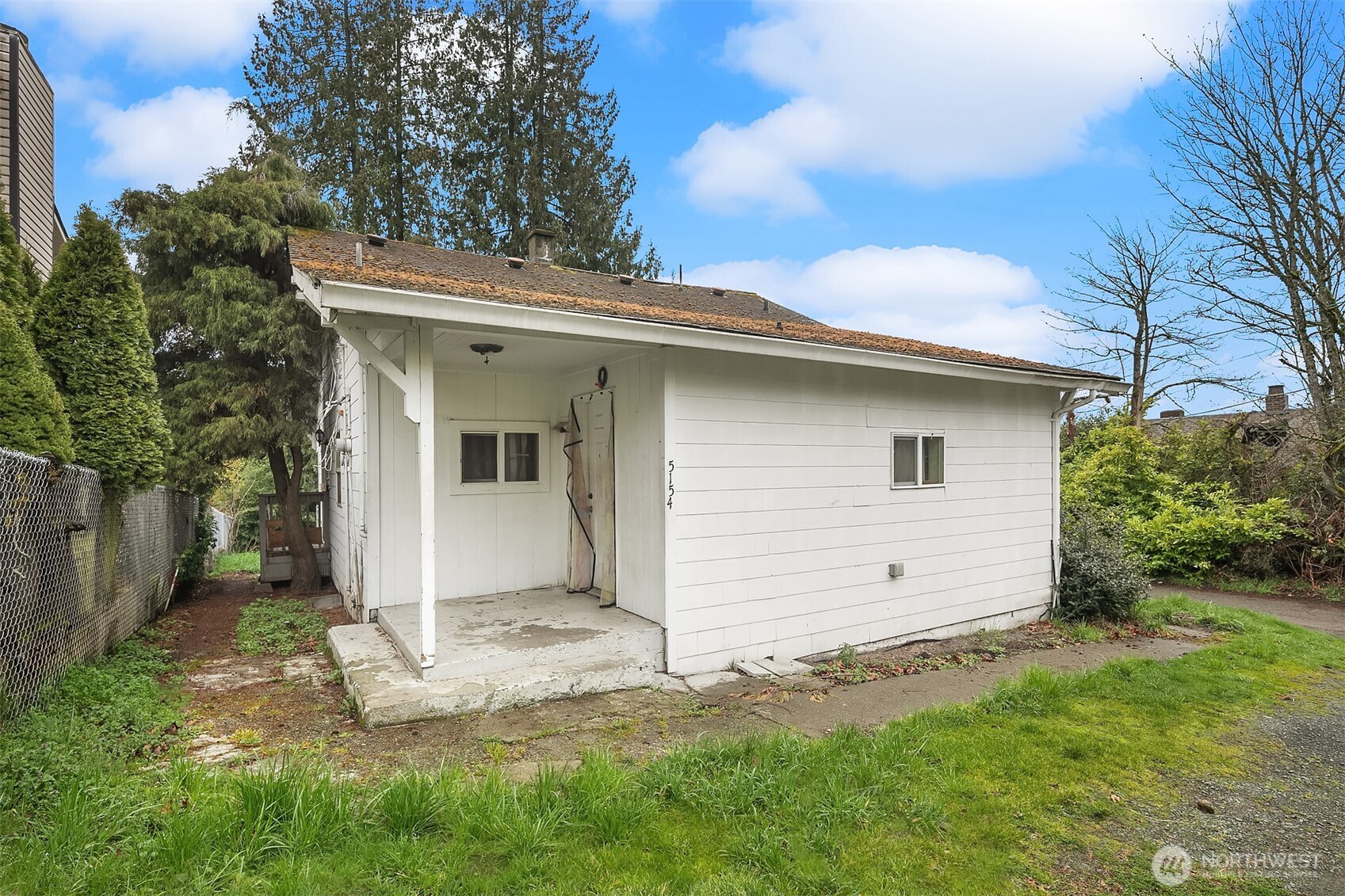 5154 South Creston Street Seattle, WA 98178 - Photo 3 of 8 a view of a house with a yard
