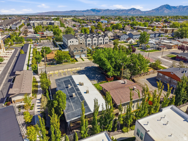831 Lennox Street, Unit 5 Midvale, UT 84047 - Photo 16 of 19 Aerial view of residential area featuring a mountainous background