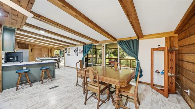 a dining room with furniture and window