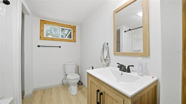 a bathroom with a sink and a toilet