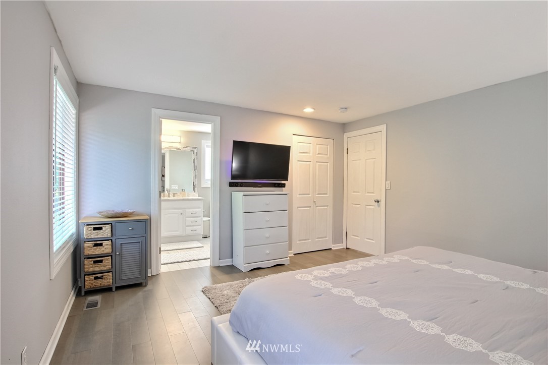 21928 8th Place West Bothell, WA 98021 - Photo 15 of 31 a bedroom with a bed and flat screen tv