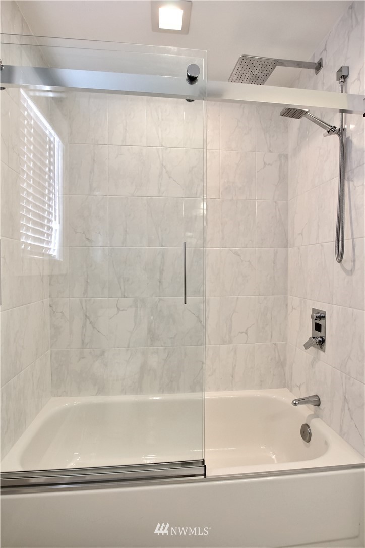21928 8th Place West Bothell, WA 98021 - Photo 21 of 31 a bathroom with a shower and a bath tub