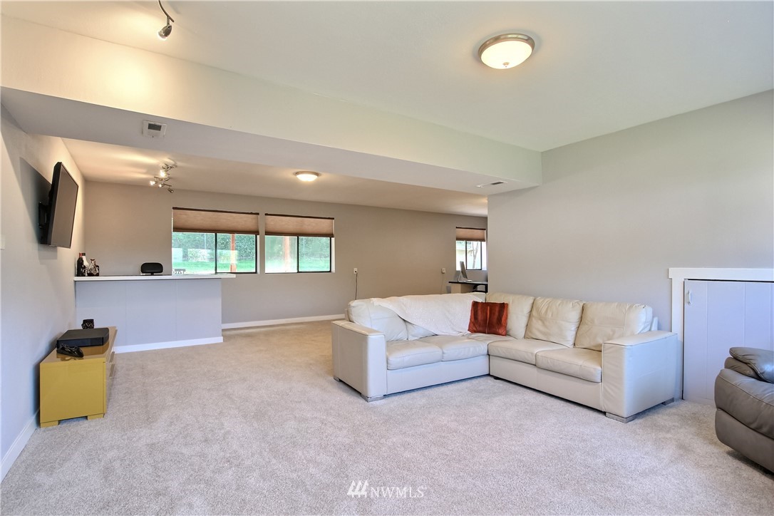 21928 8th Place West Bothell, WA 98021 - Photo 22 of 31 a living room with furniture and a couch