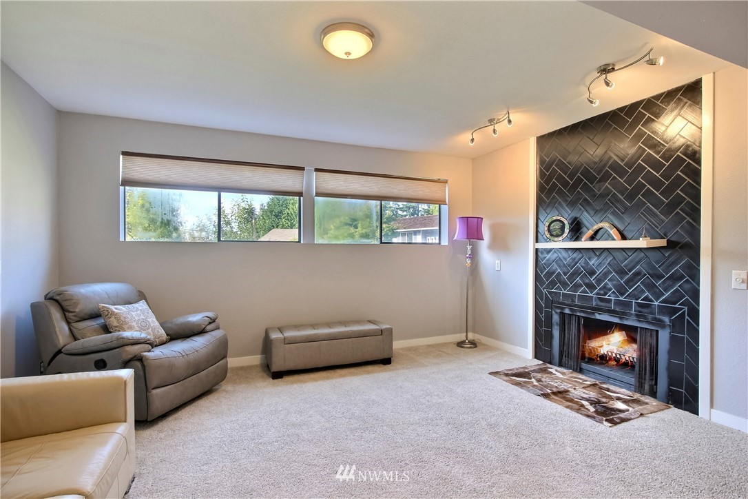 21928 8th Place West Bothell, WA 98021 - Photo 23 of 31 a living room with furniture and a fireplace