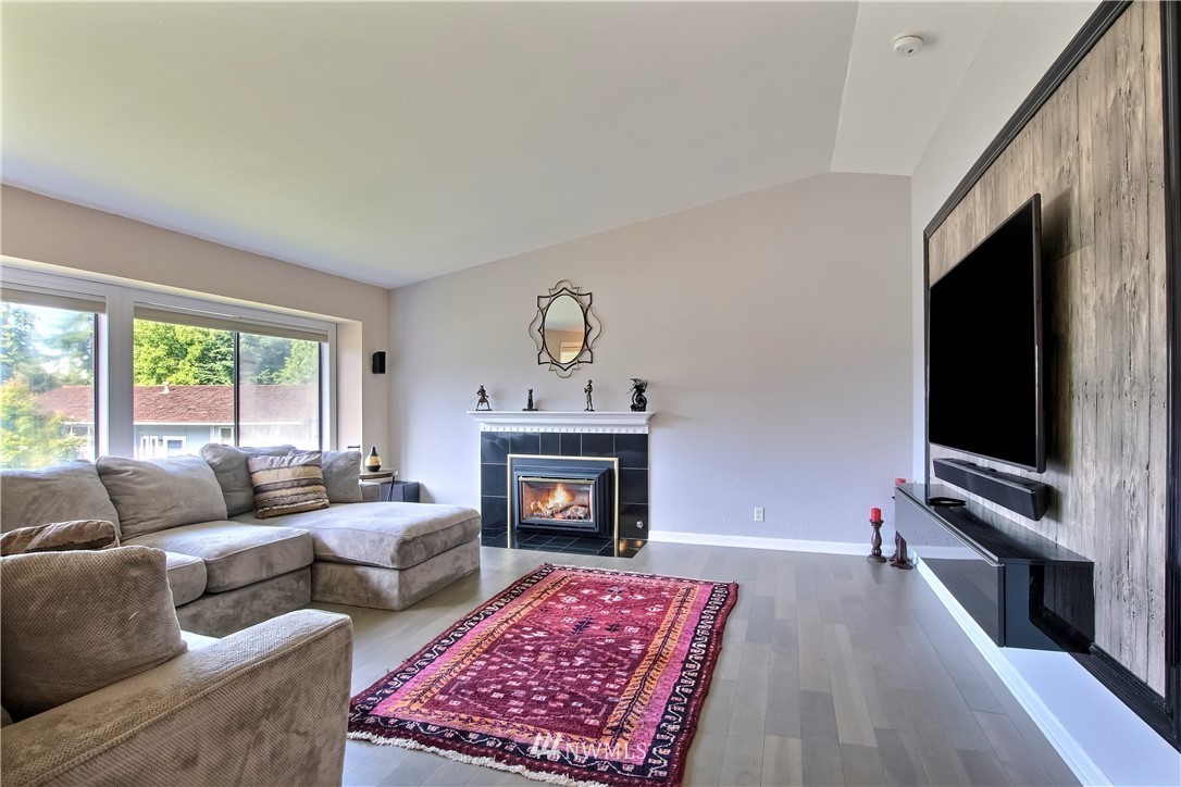 21928 8th Place West Bothell, WA 98021 - Photo 4 of 31 a living room with furniture flat screen tv and a fireplace