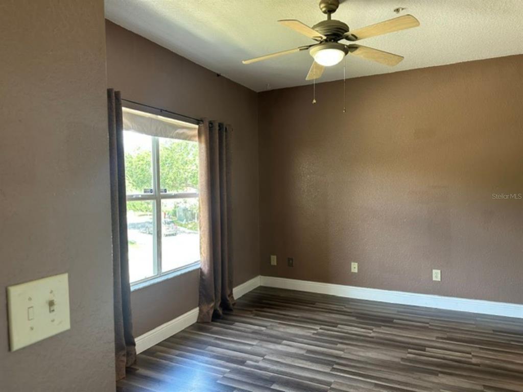 822 Camargo Way, Unit 204 Altamonte Springs, FL 32714 - Photo 15 of 32 wooden floor in an empty room with a window