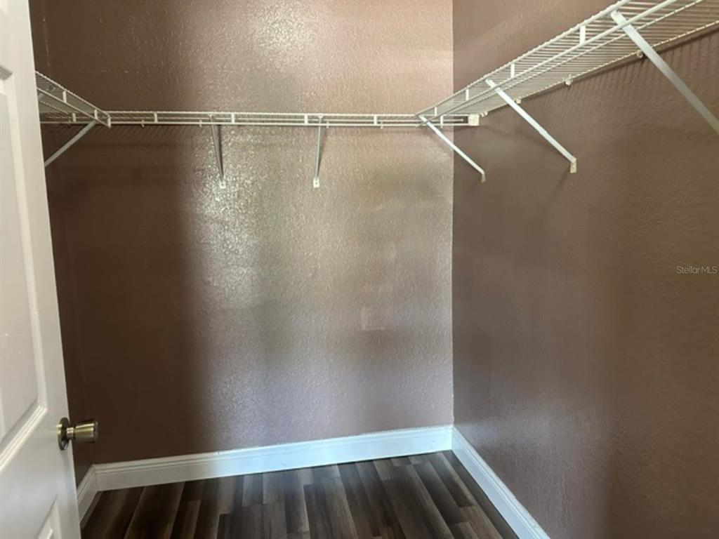 822 Camargo Way, Unit 204 Altamonte Springs, FL 32714 - Photo 16 of 32 a view of walk in closet with empty racks