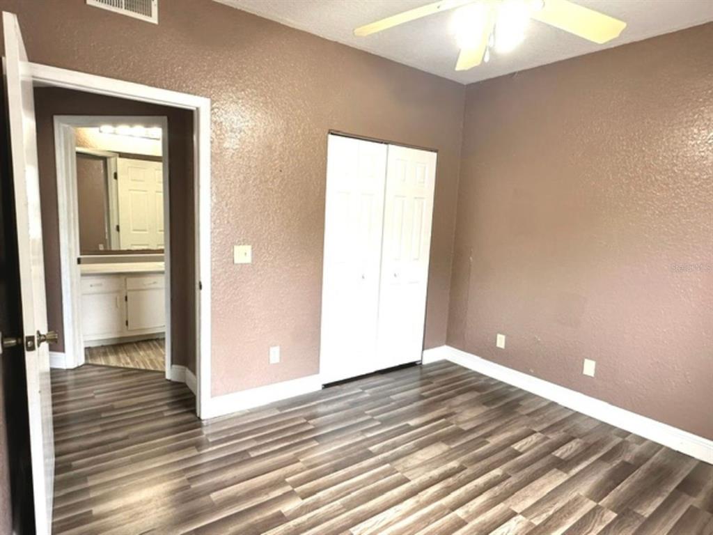 822 Camargo Way, Unit 204 Altamonte Springs, FL 32714 - Photo 18 of 32 a view of a room with wooden floor and a hallway