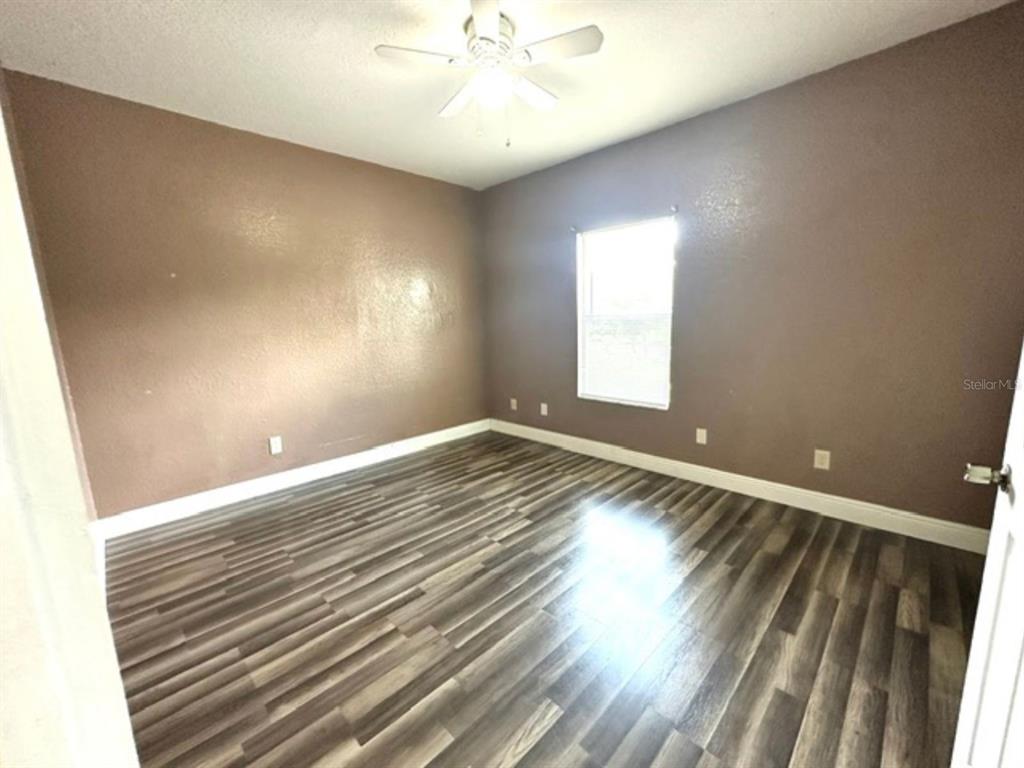 822 Camargo Way, Unit 204 Altamonte Springs, FL 32714 - Photo 19 of 32 a view of room window and wooden floor