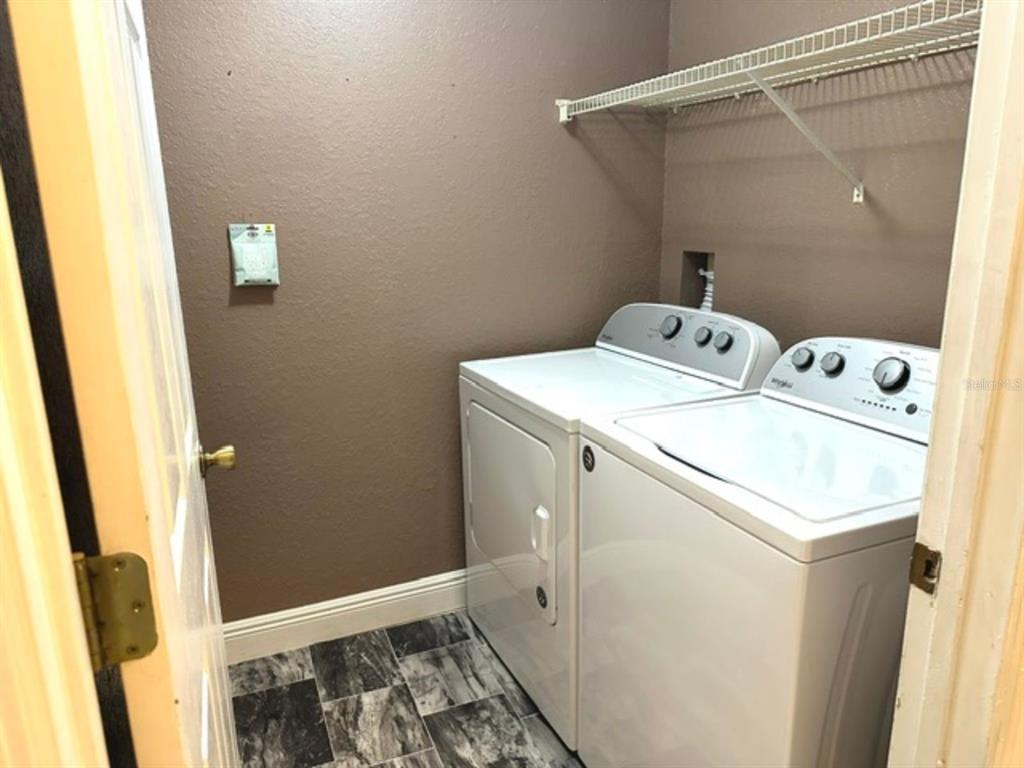 822 Camargo Way, Unit 204 Altamonte Springs, FL 32714 - Photo 24 of 32 a utility room with dryer and washer