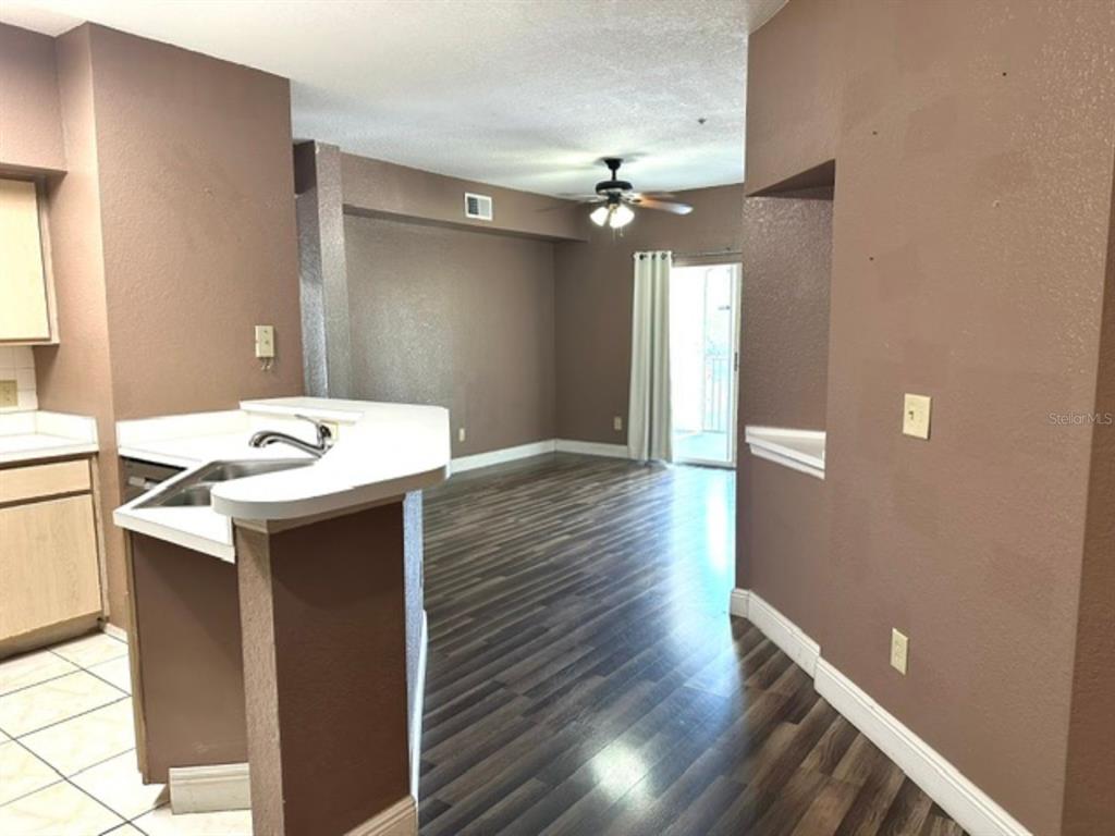 822 Camargo Way, Unit 204 Altamonte Springs, FL 32714 - Photo 7 of 32 a kitchen with a sink and a refrigerator