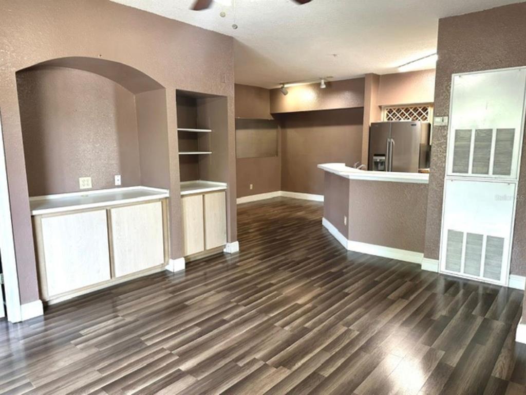 822 Camargo Way, Unit 204 Altamonte Springs, FL 32714 - Photo 10 of 32 a view of a kitchen with wooden floors and white walls
