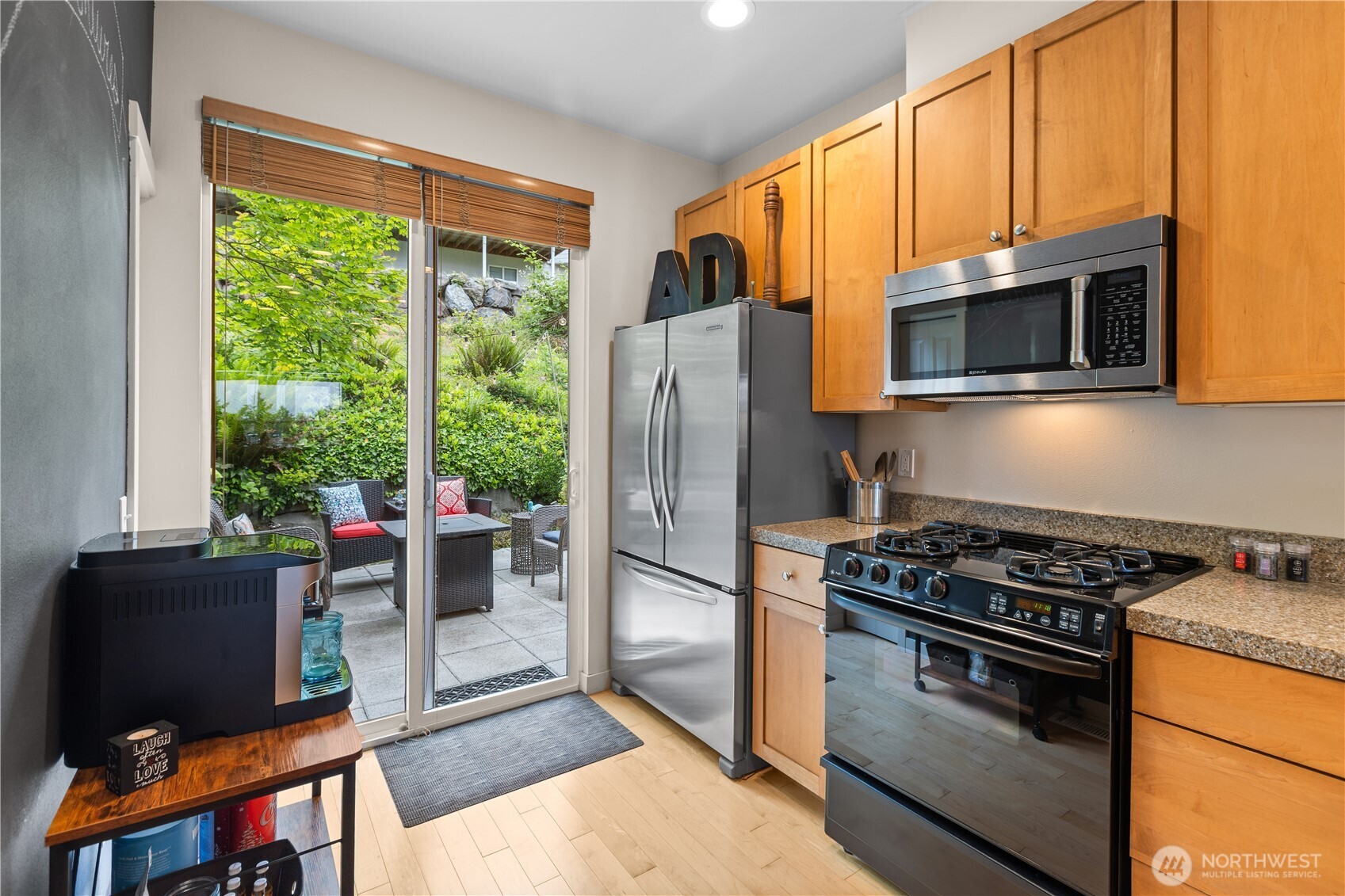 11017 Villa Rosa Lane Mukilteo, WA 98275 - Photo 17 of 37 a kitchen with stainless steel appliances granite countertop a stove a refrigerator and a microwave