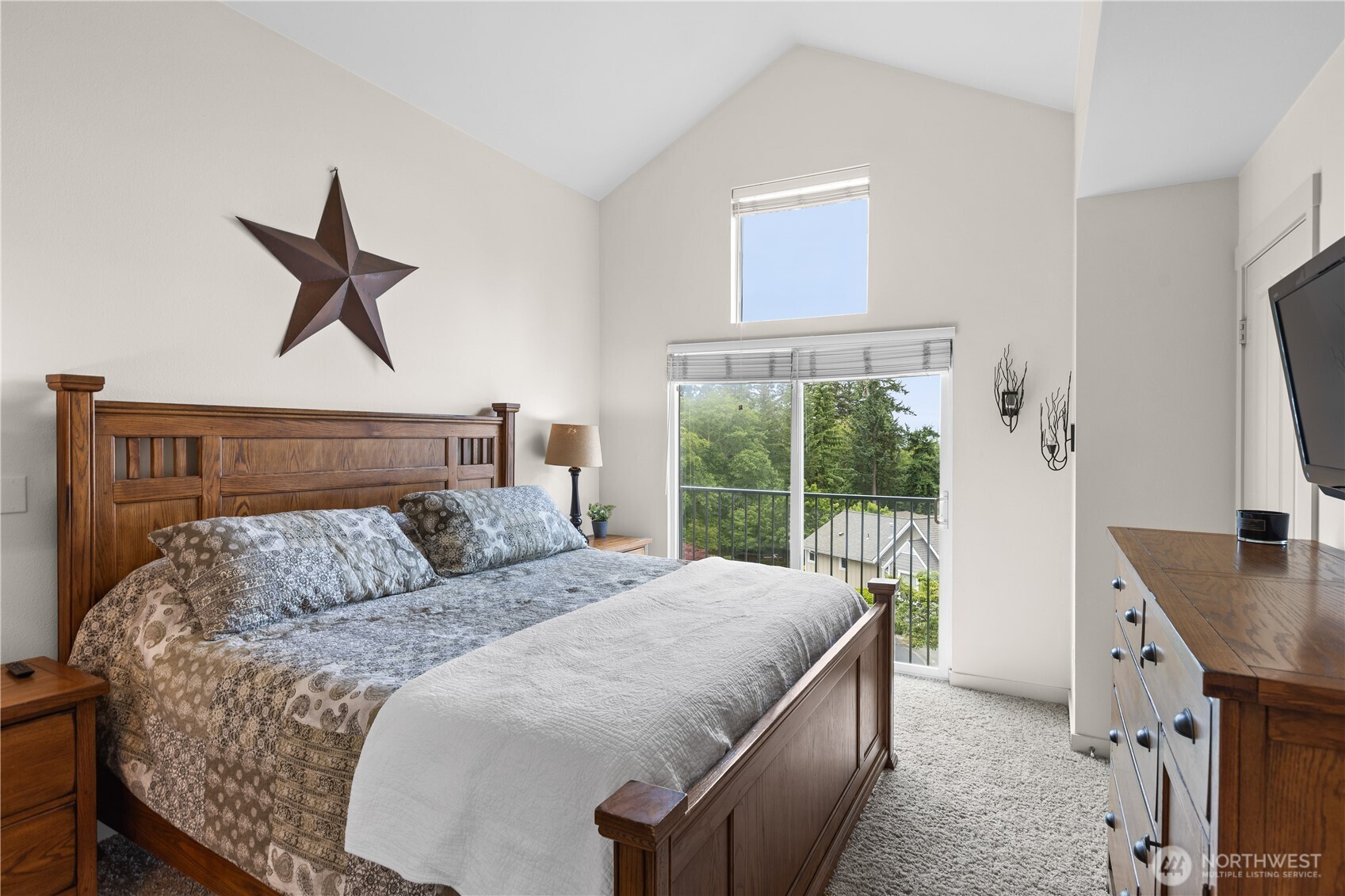 11017 Villa Rosa Lane Mukilteo, WA 98275 - Photo 19 of 37 a bedroom with a bed a window and a potted plant