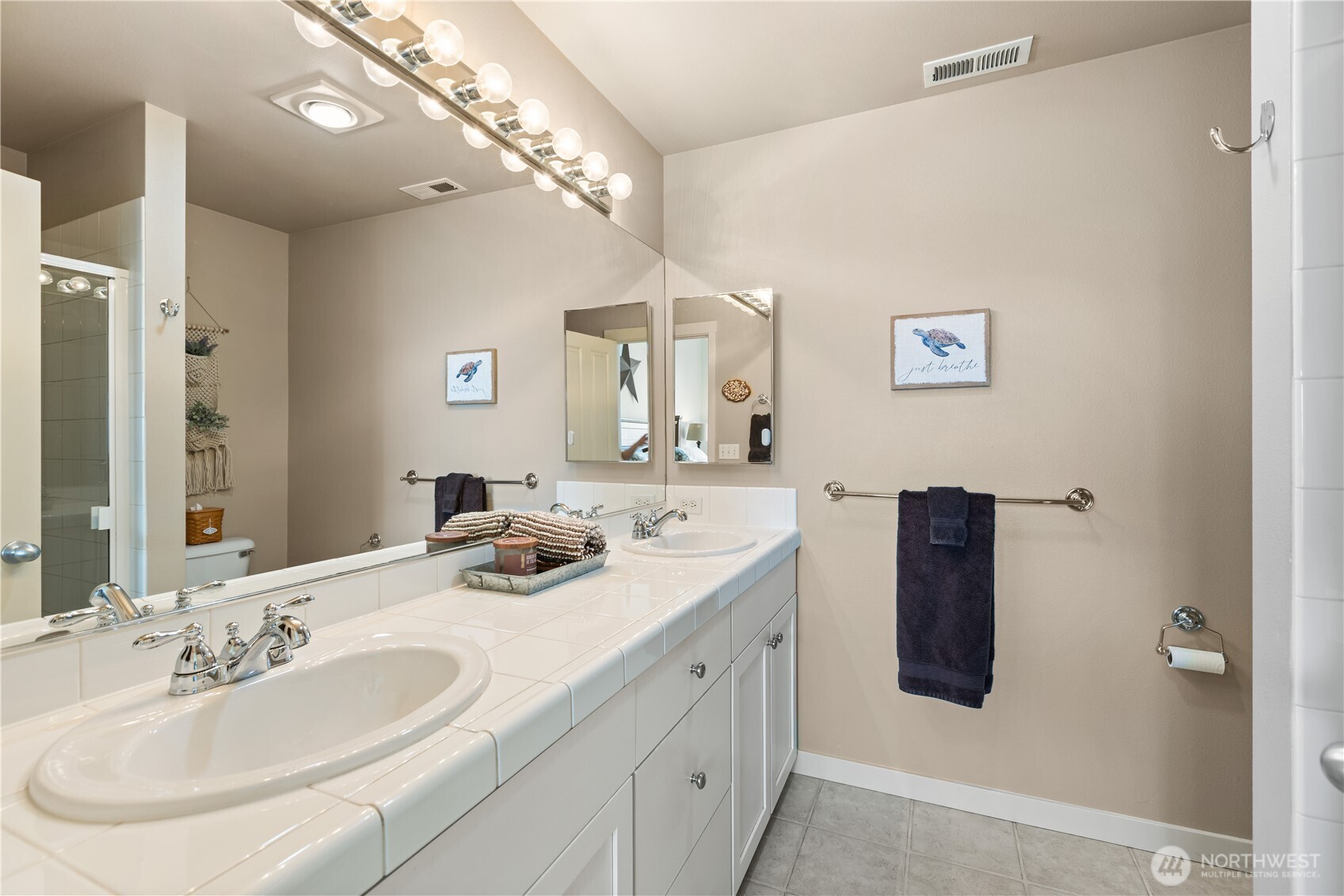11017 Villa Rosa Lane Mukilteo, WA 98275 - Photo 21 of 37 a bathroom with a double vanity sink mirror and