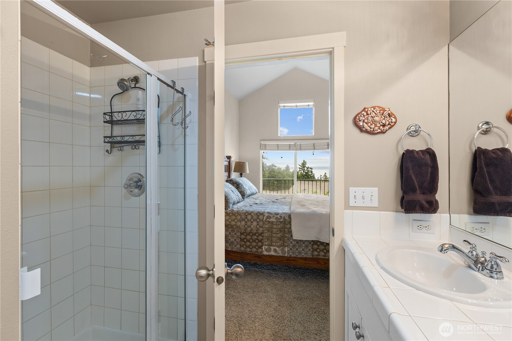 11017 Villa Rosa Lane Mukilteo, WA 98275 - Photo 22 of 37 a en suite bathroom with a sink a large mirror and shower