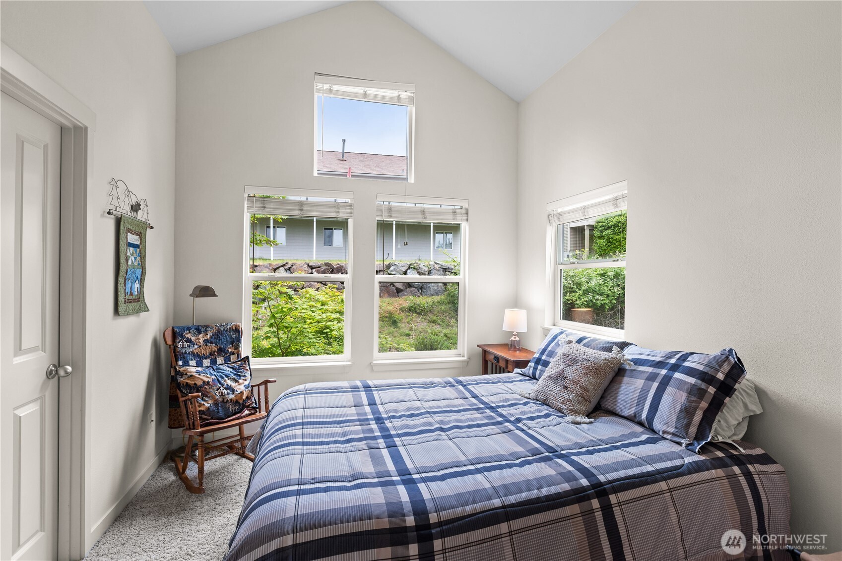 11017 Villa Rosa Lane Mukilteo, WA 98275 - Photo 23 of 37 a bed sitting in a bedroom next to a window