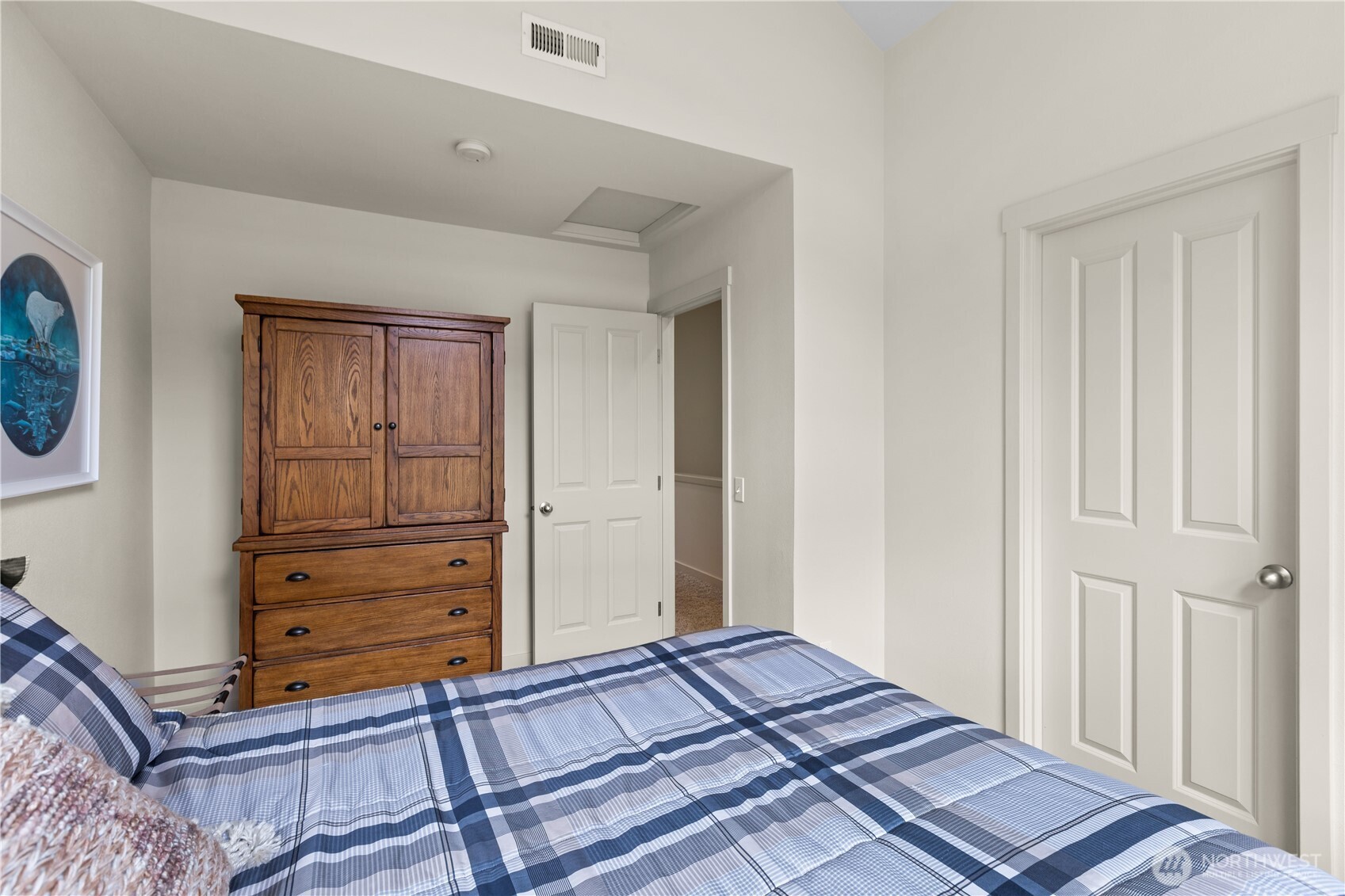 11017 Villa Rosa Lane Mukilteo, WA 98275 - Photo 24 of 37 a bedroom with a bed and painting on the wall