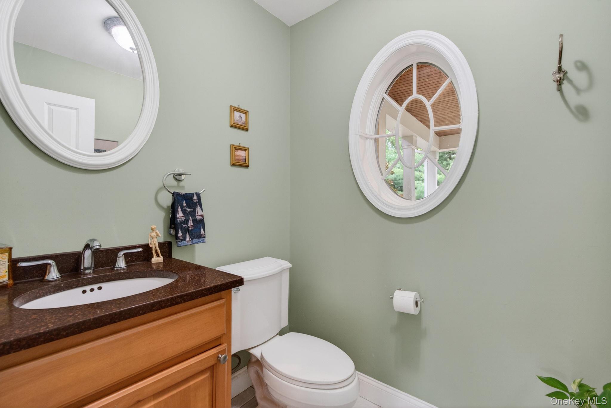 189 Bush Road Stone Ridge, NY 12484 - Photo 31 of 49 a bathroom with a toilet a sink and a mirror