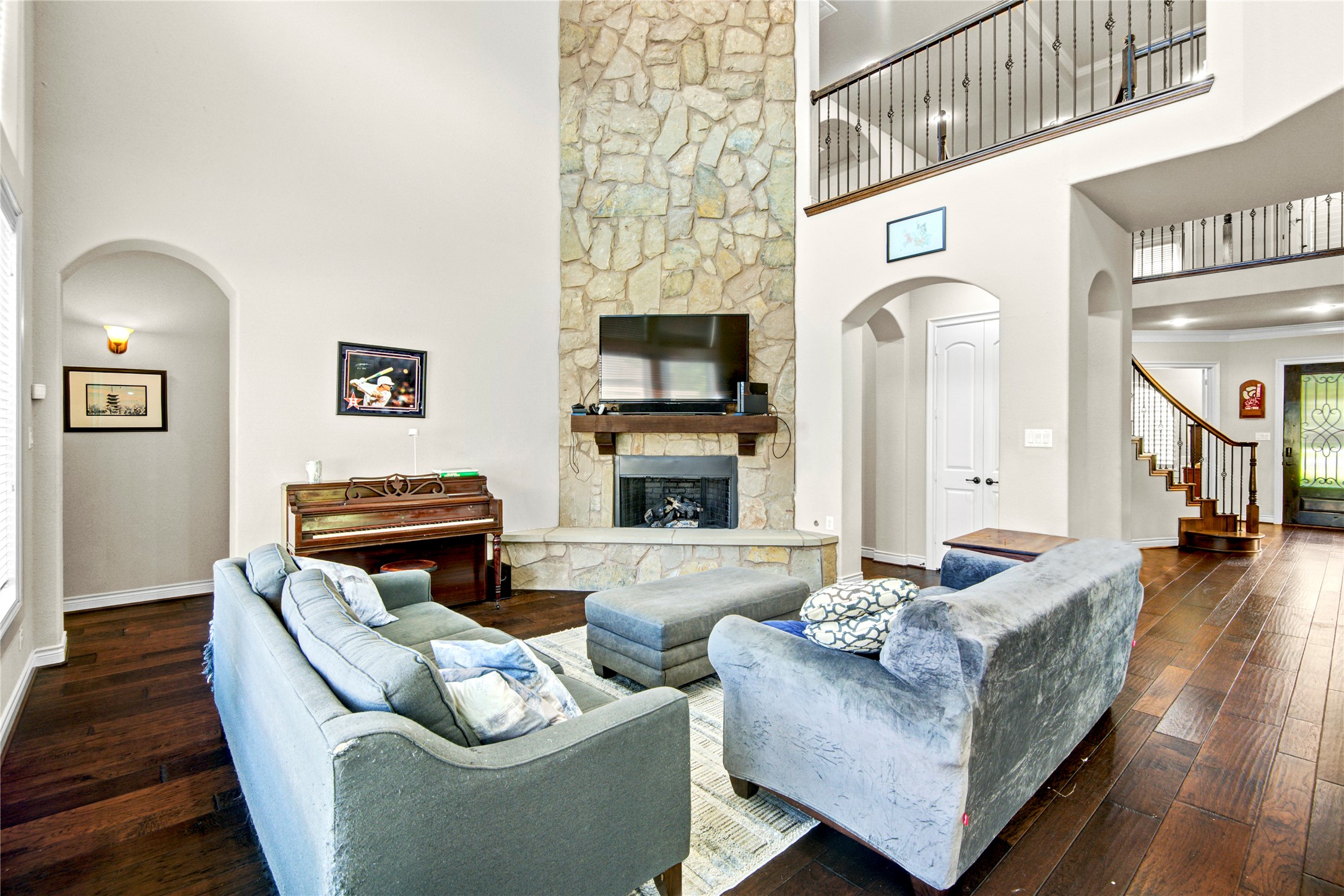 4315 Sanctuary Halls Spring, TX 77388 - Photo 46 of 50 a living room with furniture a fireplace and a flat screen tv