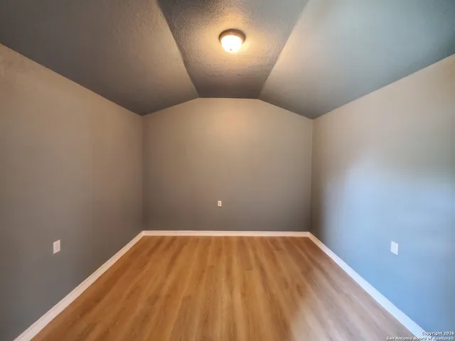 a sign that is sitting on a wooden floor