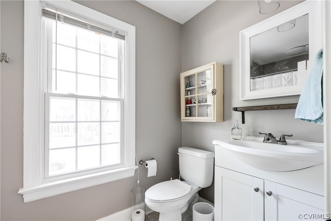 2340 Pathfinder Circle Richmond, VA 23294 - Photo 19 of 23 a bathroom with a toilet a sink and mirror