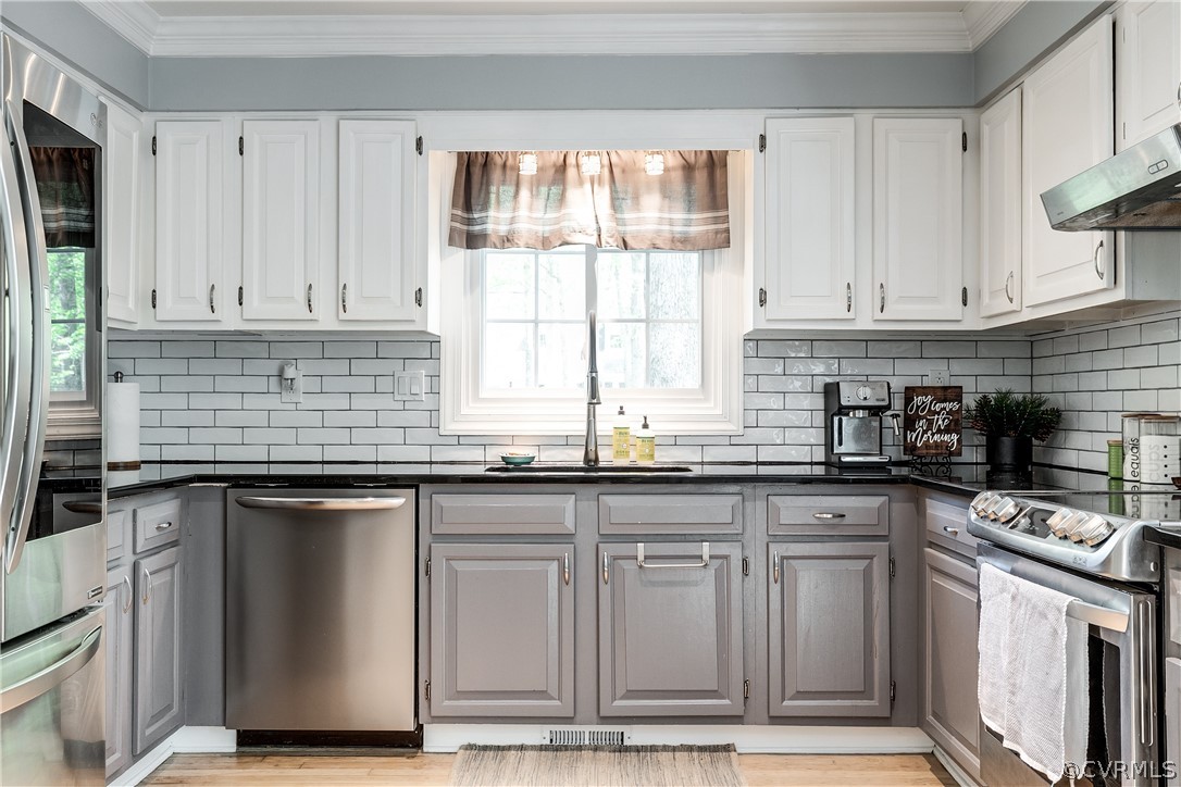 2340 Pathfinder Circle Richmond, VA 23294 - Photo 8 of 23 a kitchen with granite countertop a sink stainless steel appliances and cabinets