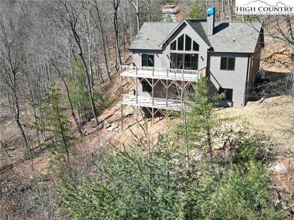 a aerial view of a house with a yard