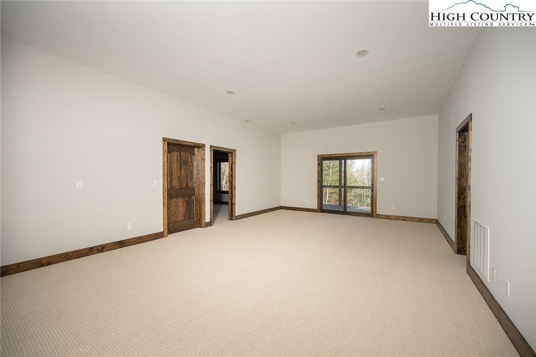 414 Elk Horn Road Ferguson, NC 28624 - Photo 25 of 27 a view of an empty room with a window