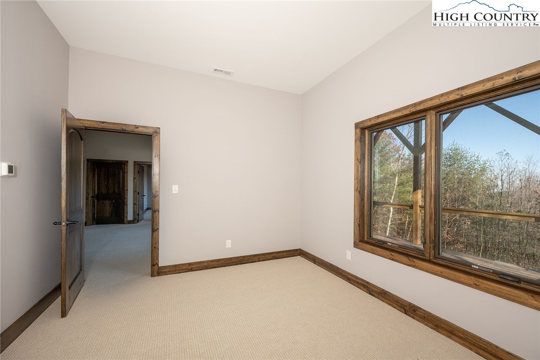 414 Elk Horn Road Ferguson, NC 28624 - Photo 10 of 27 a view of an empty room