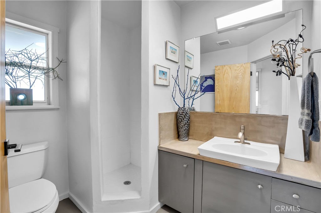 59489 Onaga Trail Joshua Tree, CA 92252 - Photo 28 of 73 a bathroom with a sink and a mirror