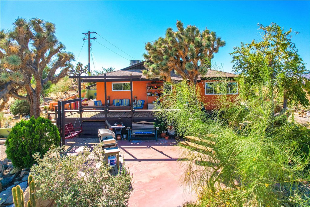 59489 Onaga Trail Joshua Tree, CA 92252 - Photo 38 of 73 a view of a house with sitting area and garden