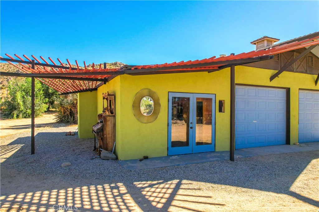 59489 Onaga Trail Joshua Tree, CA 92252 - Photo 50 of 73 a front view of a house with a big yard