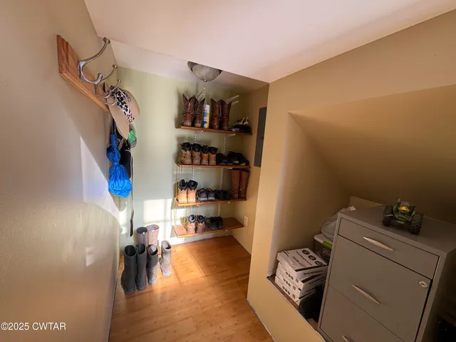 a view of living room with furniture and a fireplace