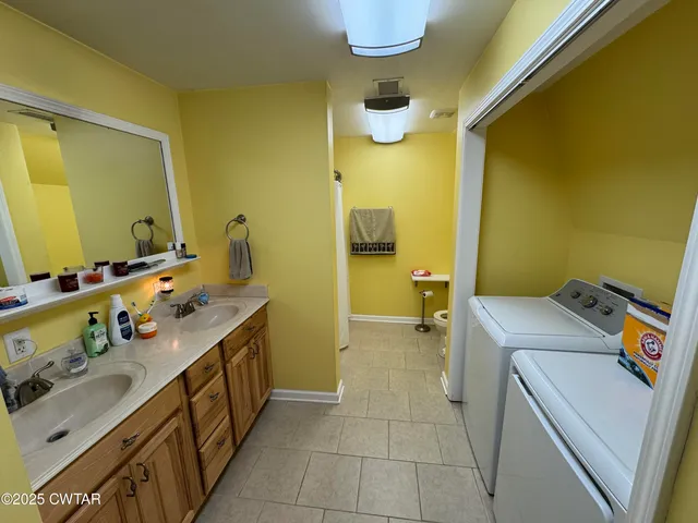 a bathroom with a sink and mirror