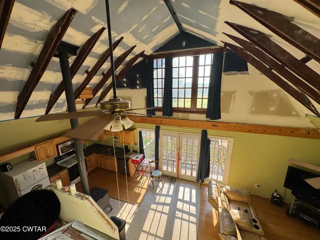 a bedroom with furniture and a window