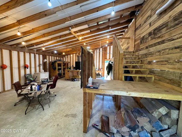 a view of an empty room with storage